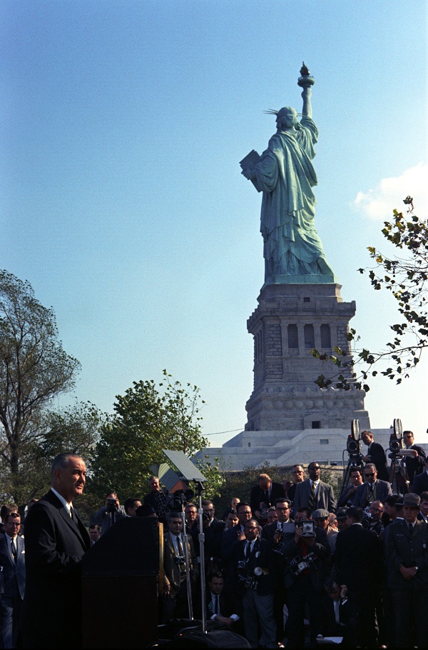 President Lyndon Johnson signed the 1965 Immigration and Nationality Act at the Statue of Liberty. Wikimedia Commons